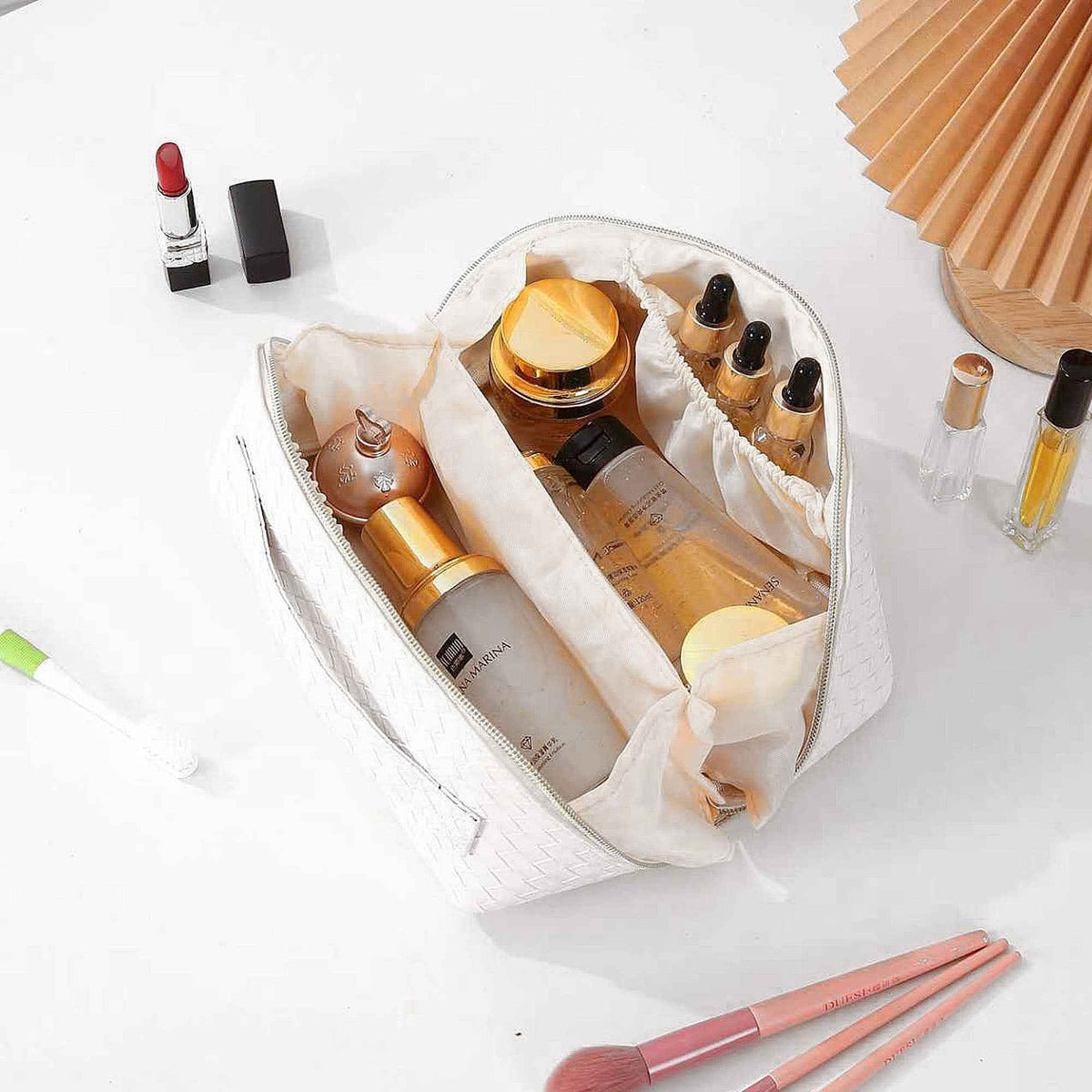 Cosmetic bag holding brushes bottles and palettes
