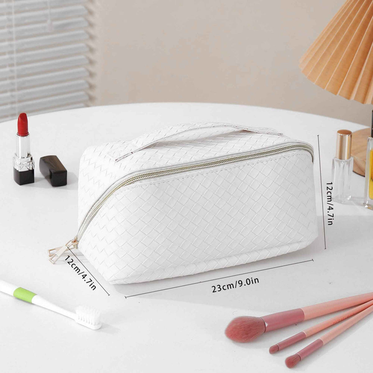 Makeup bag with separate brush storage section