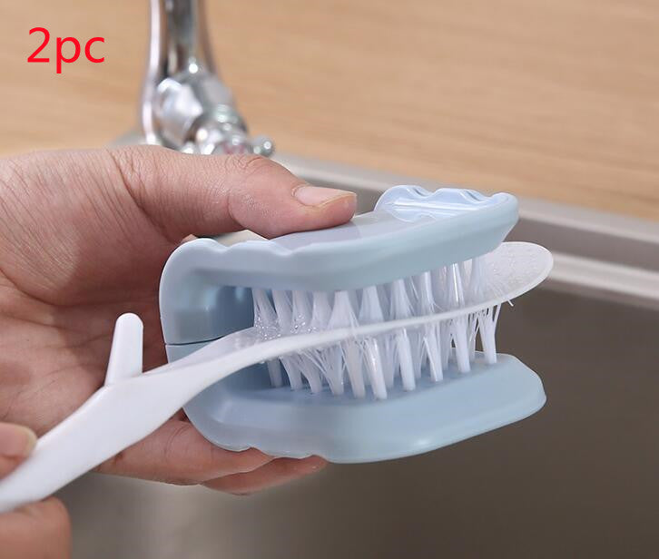 Compact knife and cutlery brush beside a sink