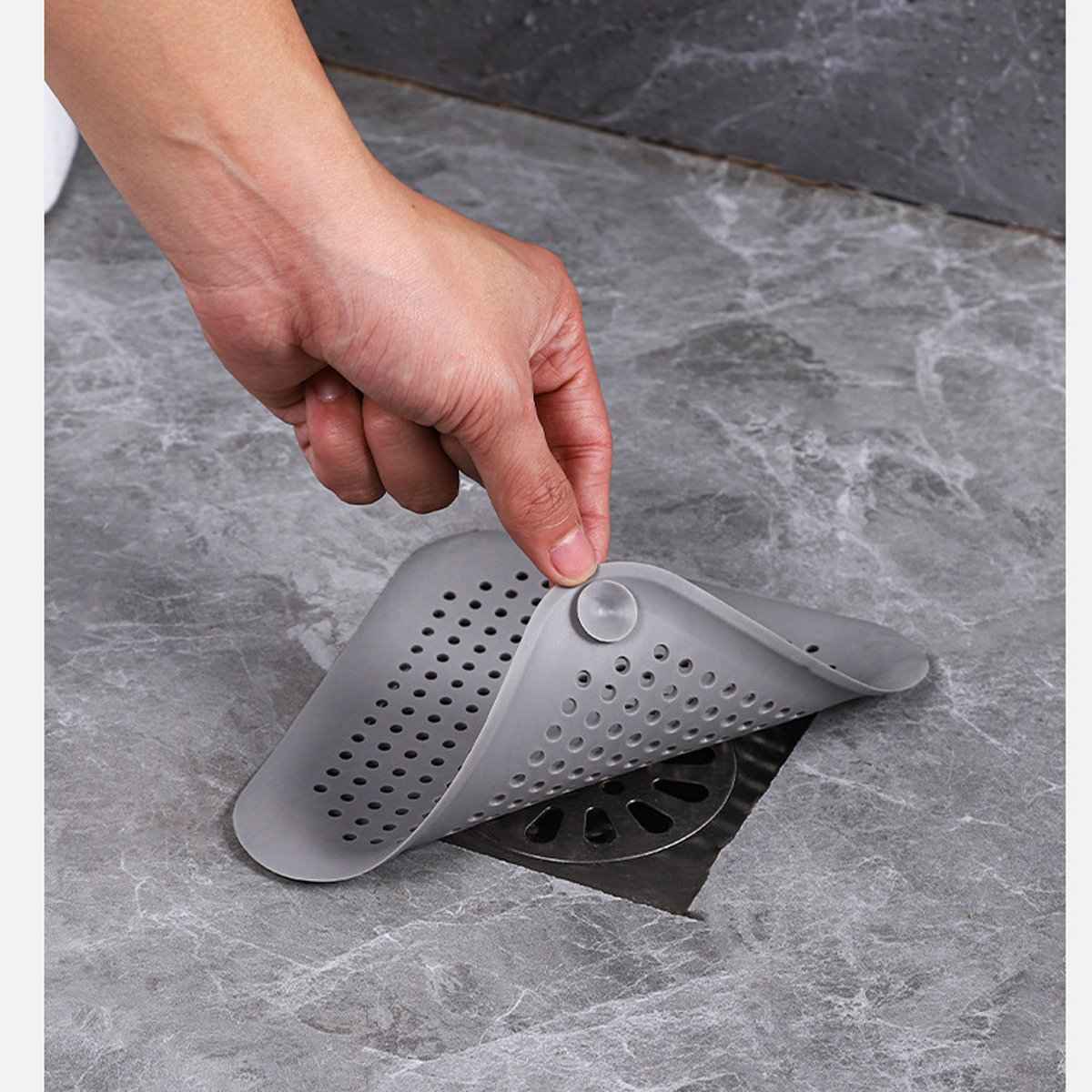 Reusable silicone hair catcher designed to reduce drain clogs