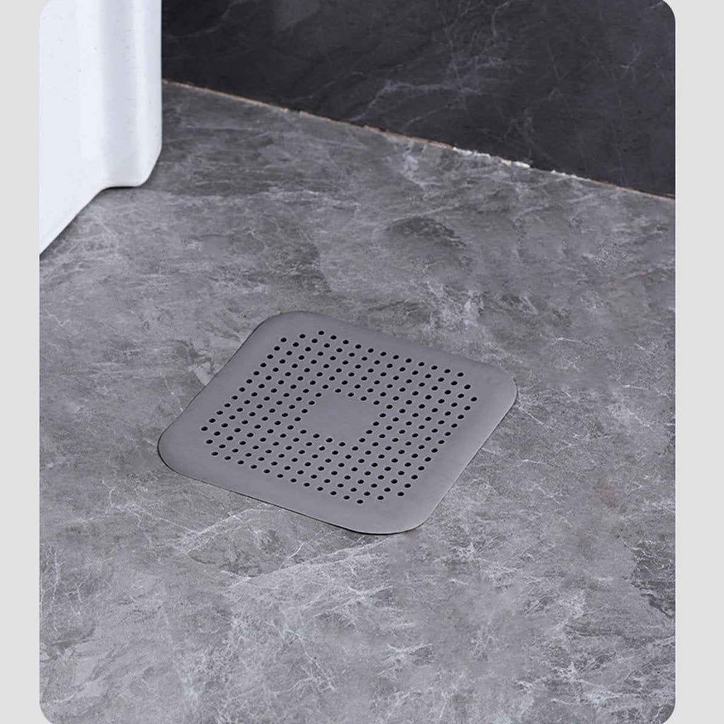 Flexible drain catcher lifted for quick hair and debris cleanup